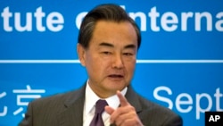 Chinese Foreign Minister Wang Yi speaks at an event to commemorate the 10th anniversary of the Sept. 19th joint statement agreed as part of the six-party talks on North Korea's nuclear program at the Diaoyutai State Guesthouse in Beijing, Sept. 19, 2015. 
