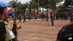 FILE - United Nations peacekeeping troops take part in a ceremony in the capital city of Bangui, Central African Republic, Sept. 15, 2014.