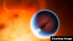 The planet HD 189733b is shown here in front of its parent star in an artist's rendition. A belt of wind around the equator of the planet travels at 5400mph from the heated day side to the night side. 