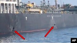 This June 13, 2019, image released by the U.S. military's Central Command, shows damage and a suspected mine on the Kokuka Courageous in the Gulf of Oman near the coast of Iran. (U.S. Central Command via AP)