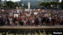 People take part in a protest against the use of protective masks amid the coronavirus pandemic, in Madrid, Spain, Aug. 16, 2020.