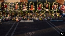 FILE - Messages are written at a memorial outside Star Dance Studio in Monterey Park, California, Thursday, January 26, 2023. The U.S. is setting a record pace for mass killings in 2023. (AP Photo/Jae C. Hong, File)
