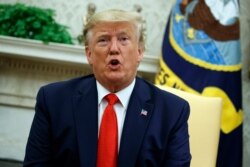 FILE - President Donald Trump speaks in the Oval Office of the White House, Sept. 11, 2019.