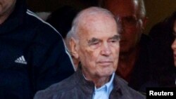 Convicted former Nazi SS captain Erich Priebke (L) leaves after attending a mass at a church in northern Rome, (File photo).