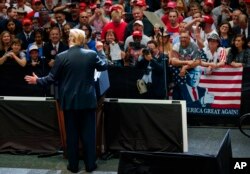 President Donald Trump speaks at the North Side Gymnasium in Elkhart, Ind., Thursday, May 10, 2018, during a campaign rally.