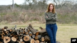 Rachel Van Lear is at her home in Buda, Texas, Tuesday, March 9, 2021. On the same day a global pandemic was declared, she developed symptoms of COVID-19. A year later, she’s still waiting for them to disappear. (AP Photo/Eric Gay)