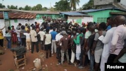 People wait to cast their votes during Liberia's presidential election in Monrovia, Liberia, on Oct. 10, 2023.