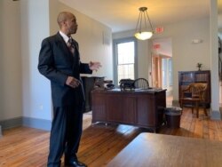 Actor Dexter Hamlett portrays Carter Woodson for tour groups that visit the home in Washington. (Chris Simkins/VOA)