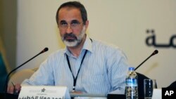 Head of the Syrian National Coalition for Opposition and Revolutionary Forces Mouaz al-Khatib speaks during the group's meeting in Istanbul, Turkey, May 23, 2013.