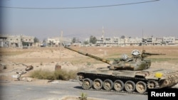 Suasana di Al-Bouydah, selatan Damaskus, setelah dikuasai oleh tentara yang setia kepada Presiden Bashar al-Assad (17/10).