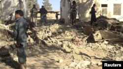 Afghan forces inspect at the site of suicide attack in Spin Boldak district of Kandahar province January 6, 2013. 