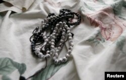 FILE - Prayer beads are shown inside the home of San Bernardino shootings suspects Syed Rizwan Farook and Tashfeen Malik in Redlands, Calif., Dec. 4, 2015,