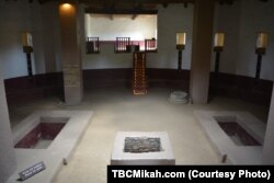 Signs within the interior of a restored Kiva at the Aztec Ruins National Monument urge visitors to respect the ancient space.