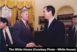 Senior White House Advisor John Angell with President Bill Clinton December 17, 1996. (White House Photo)
