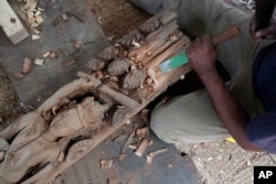 A woodworker from the Newar ethnic community carves in Lalitput, Nepal, July 19, 2017. The temples lost in the 2015 earthquake were the jewel of Patan Durbar Square, which is thronged by thousands of tourists and local visitors every day.