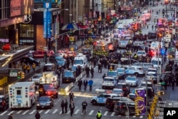 FILE - Law enforcement officials work following an explosion near New York's Times Square, Dec. 11, 2017.