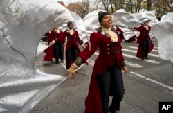 Members of the Hendrickson High School band from Pflugerville, Texas, march on Central Park West during the Macy's Thanksgiving Day Parade in New York, Nov. 24, 2016.