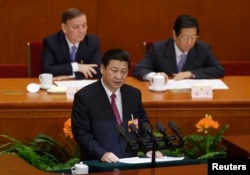 Newly-elected President Xi Jinping delivers a speech during the closing session of the National People's Congress in Beijing, March 17, 2013.
