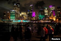 Office building are lit with colorful projections of light on the first night of the Sydney Vivid Festival light and sound show in Sydney, Australia, May 26, 2017.