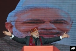 FILE - Indian Prime Minister Narendra Modi addresses a political gathering of his Bharatiya Janata Party, in Himachal Pradesh, in Dharmsala, India, Dec. 27, 2018.