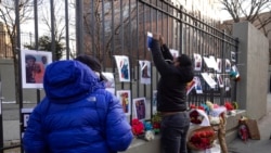 Volunteers with the "Wall of Hope Foundation" build a memorial wall for the victims of New York City's deadliest fire in three decades, in the Bronx borough of New York, Jan. 12, 2022.