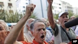 A pensioner shouts slogans during an anti-austerity protest in front of the EU headquarters in Athens, October 8, 2012.