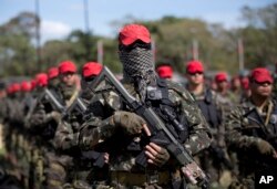 Soldiers who will be deployed during the Olympic games are presented during a ceremony in Rio de Janeiro, Brazil, July 8, 2016.
