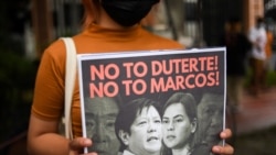 A demonstrator holds a poster during a protest following the presidential bid announcement of Ferdinand “Bongbong” Marcos Jr., son of late dictator Ferdinand Marcos, at the Commission of Human Rights, in Quezon City, Metro Manila, Philippines, Oct. 6, 202