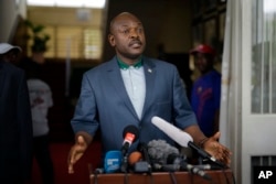 FILE - President Pierre Nkurunziza makes a brief statement at the presidential palace in Bujumbura, Burundi, May 17, 2015.