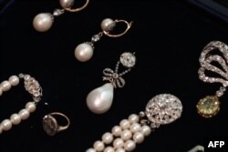 In this file photo taken on Oct. 19, 2018, the 'Queen Marie Antoinette's Pearl,' center, is pictured with other jewellery during a photocall for the sale of 'Royal Jewels from the Bourbon Parma Family.'