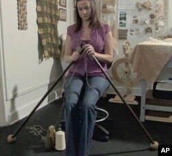 Jamie Galloway uses giant knitting needles to make items made of cotton free of pesticides and chemicals.