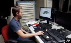 Ben Chalker shows the CAD software of a 3D-printable gun called the Liberator in Austin, Texas, Aug. 1, 2018.