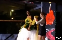 French designer does a live haute couture demonstration on the runway during Haiti Fashion Week. (Photo: Matiado Vilme for VOA)