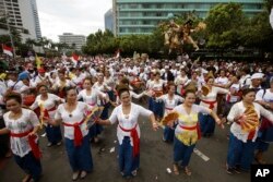 Balinese dancers perform during a rally in Jakarta, Indonesia, Dec. 4, 2016. Thousands of Indonesians rallied in the center of the capital Jakarta on Sunday, calling for tolerance and unity after massive protests by conservative Muslims against the city's minority Christian governor.