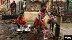 Children collecting drinking water from a home tube well in Teghoria village, North 24 Paraganas. Arsenic-contaminated groundwater has killed scores of people in the vicinity in the past years. (M. Hussain/VOA)