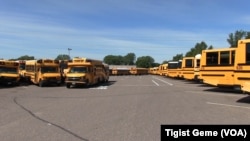 A fleet of Metropolitan Transportation Network buses in a parking lot at the company's headquarters in Fridley, Minnesota, Aug. 10, 2017.