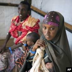Newly arrived refugees wait to be registered at a refugee camp in Dadaab, near Kenya's border with Somalia, August 29, 2011.