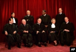 US Supreme Court justices pose for a group portrait in 1994. From left, front are: Antonin Scalia, John Paul Stevens, Chief Justice William Rehnquist, Sandra Day O'Connor and Anthony Kennedy. From left, back row are: Ruth Bader Ginsburg, David Souter, C