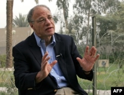 Human Rights Watch director Richard Dicker speaks during an interview in Baghdad's Green Zone October 19, 2005.