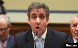 Michael Cohen, the former personal attorney of U.S. President Donald Trump, reads his opening statement as he testifies at a House Committee on Oversight and Reform hearing on Capitol Hill in Washington, Feb. 27, 2019.