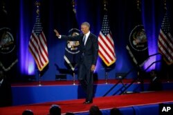 President Barack Obama waves as he arrives to speaks at McCormick Place in Chicago, giving his presidential farewell address, Jan. 10, 2017.
