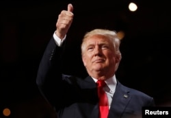 U.S. Republican presidential nominee Donald Trump gives a thumbs up at the Republican National Convention in Cleveland, Ohio, U.S. July 21, 2016.