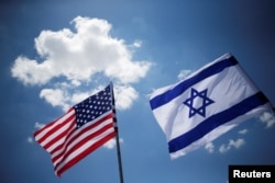 American and Israeli flags are seen during a dress rehearsal of the arrival ceremony to be held to welcome U.S. President Donald Trump upon his arrival, at Ben Gurion International Airport in Lod, Israel, May 21, 2017.