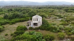 Bekas bangunan rumah yang rusak di lokasi likuefasi Petobo, Palu Selatan, Kota Palu, Sulawesi Tengah. Senin, (6/10) Foto : Yoanes Litha