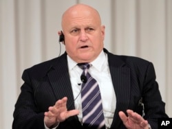 FILE - Former U.S. Deputy Secretary of State Richard Armitage speaks during a symposium of the 'Charges in Leadership and the Future Course of Japan-US-China Trilateral Relations' in Tokyo Friday, Oct. 26, 2012.