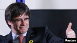 Carles Puigdemont, the dismissed president of Catalonia, arrives to speak after watching the results of Catalonia's regional election in Brussels, Belgium, Dec. 21, 2017.