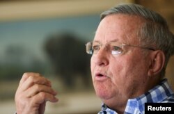 FILE - John Hume, the world’s largest private rhino owner and breeder, speaks to Reuters at his farm outside Klerksdorp, in the north west province, South Africa, Aug. 14, 2017.