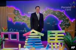 Panama President Juan Carlos Varela Rodríguez poses for photographers before a conference on the Panama invest in Hong Kong, Tuesday, April 2, 2019.