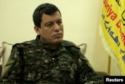 FILE - Mazloum Kobani, SDF commander in chief is pictured during an interview with Reuters in Ain Issa, Syria, Dec. 13, 2018