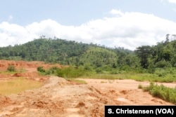 Toxic sludge split over from a dam at a small-scale mining site in southeastern Ghana, May 23, 2019.